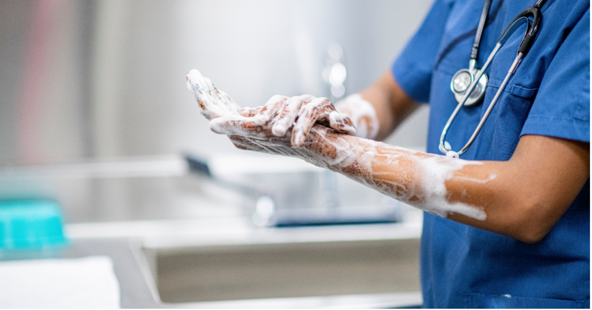 Medical professional using bulk handwash/soap